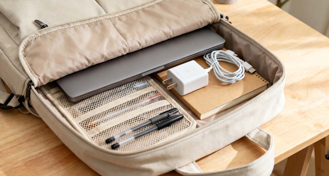The Complete Guide to Choosing the Perfect Bag with Laptop Storage - laptop bag open bag showing padded laptop sleeve, accessories, and documents neatly arranged