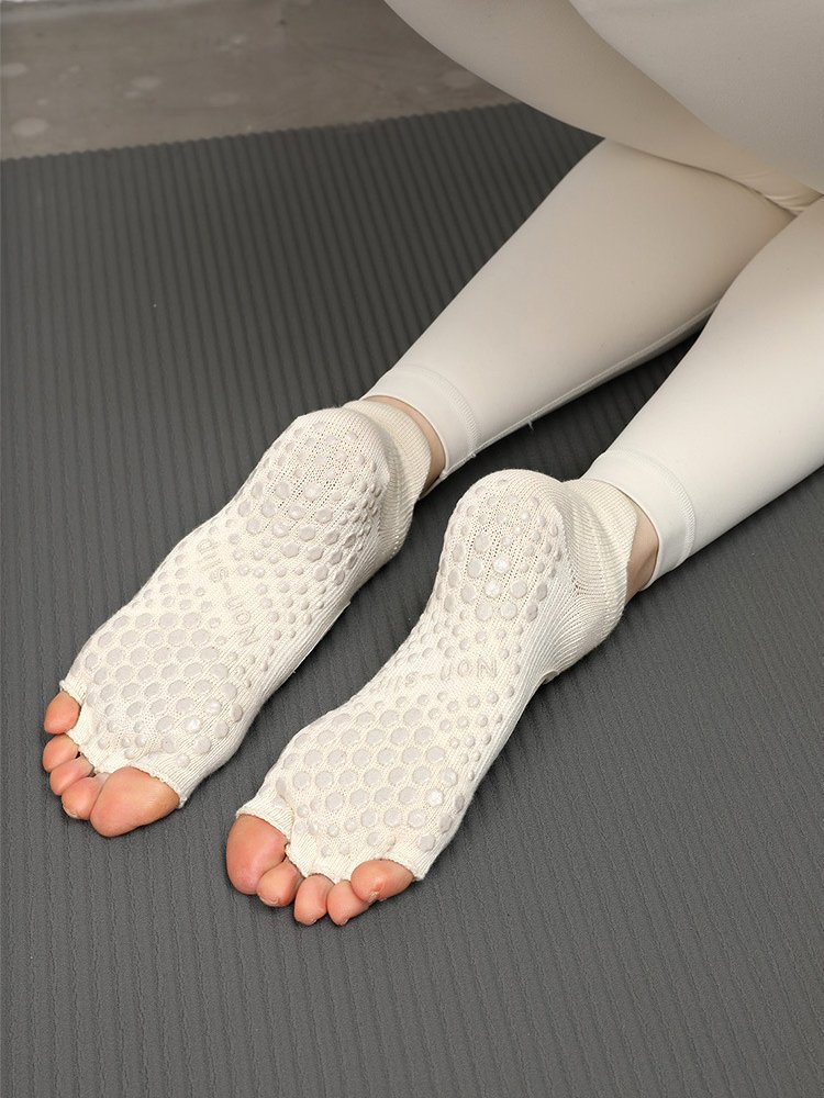 Close-up of Toeless Pilates Socks showing the exposed toes and circular grips.